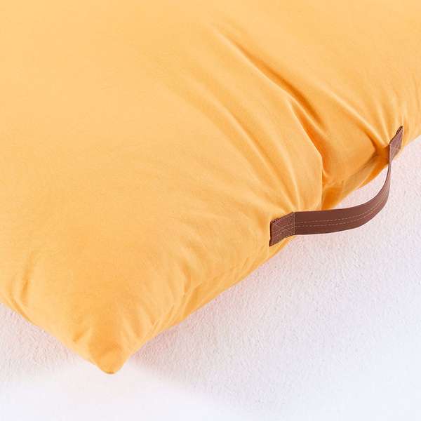 Yellow floor pillow top